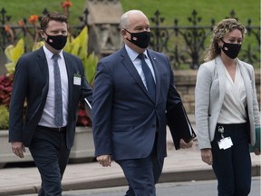 Conservative Leader Erin O'Toole walks to a caucus meeting in Ottawa with his chief of staff Tausha Michaud and campaign manager Fred DeLorey in Ottawa on Sept. 9, 2020.