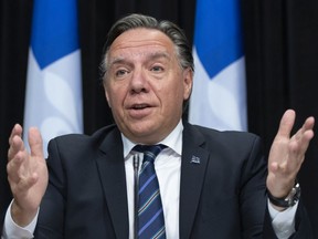 "As soon as citizens know someone who has experienced the consequences of COVID, skeptical people are no longer skeptical," says Premier François Legault, seen in a file photo.