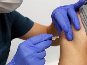 A volunteer is injected with an experimental Chinese coronavirus disease (COVID-19) vaccine as Turkey began final Phase III trials at Kocaeli University Research Hospital in Kocaeli, Turkey, on Friday,  Sept., 25, 2020.