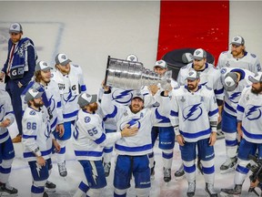 Tampa Bay Lightning defenseman Ryan McDonagh (27) hoists the Stanley Cup after the Lightning defeat the Dallas Stars in game six of the 2020 Stanley Cup Final at Rogers Place.
