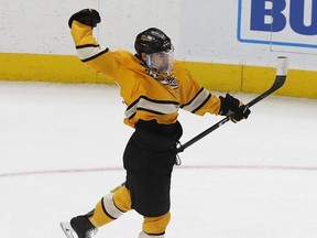 Michigan Tech forward Jake Lucchini reacts after scoring during the first period of the Great Lakes Invitational college hockey championship game against Lake Superior State on Dec. 31, 2018, in Detroit.