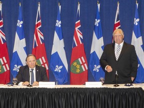Ontario Premier Doug Ford stands alongside Quebec Premier Francois Legault, as he speaks to the media, at the start of the Ontario-Quebec Summit, in Toronto, on Wednesday, September 9, 2020.
