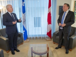Federal Conservative Leader Erin O'Toole, left, and Quebec Premier Francois Legault get set to start their meeting in Montreal, Monday, Sept. 14, 2020.