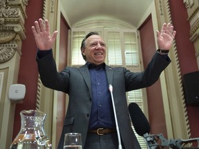 Quebec Premier François Legault waves to members of his caucus at a CAQ government pre-session caucus, Friday, Sept. 11, 2020 at the legislature in Quebec City.