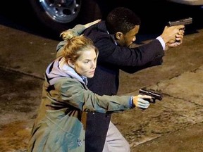 Sienna Miller and Chadwick Boseman in 21 Bridges (2019). Photo by Random - © Instagram