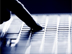 Hacker finger on keyboard