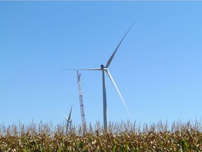 Wind turbines and a crane tower above a field of corn along Oil Heritage Road in Plympton-Wyoming, Ontario, in this file photo from September 2015.