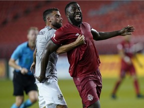 Toronto FC forward Jozy Altidore (17) reacts to being held by Montreal Impact defender Rudy Camacho (4) during the first half at BMO Field on Tuesday. Montreal defeated Toronto 1-0.