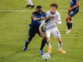 Montreal Impact defender Jukka Raitala (22) and Philadelphia Union battle for the ball during the second half of the match between the Montreal Impact and Philadelphia Union at Red Bull Arena in Harrison, N.J., on Sunday, Sept. 20.