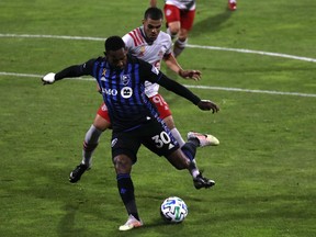 Impact forward Romell Quioto kicks the ball against Toronto FC defender Auro earlier this month. Quioto leads Montreal with six goals this season.
