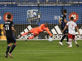 Montreal Impact goalkeeper Clement Diop makes a save against Toronto FC during the first half at Stade Saputo on Sept. 9, 2020.