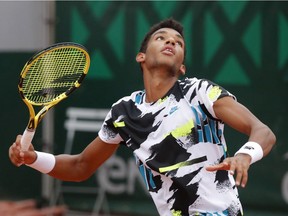 Montreal's Felix Auger Aliassime in action during his French Open first-round match against Japan's Yoshihito Nishioka  in Paris on Paris on Sept. 28, 2020.