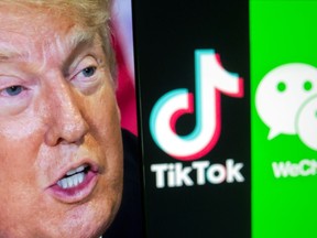 A picture of U.S. President Donald Trump is seen on a smartphone in front of displayed Tik Tok and WeChat logos in this illustration taken on Friday, Sept. 18, 2020.