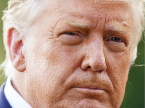 U.S. President Donald Trump faces reporters as he departs for campaign travel to Minnesota from the South Lawn at the White House in Washington on Friday,  Sept. 8, 2020.