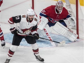 Montreal Canadiens goaltender Carey Price and Arizona Coyotes' Alex Galchenyuk wait for an incoming shot during first period at the Bell Centre in Montreal, on Jan. 23, 2019.