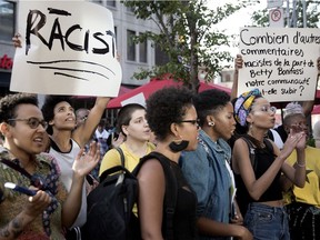 Protesters demonstrate against Robert Lepage's SLAV in 2018. The show featured a mostly white cast singing Black American slave spirituals and playing Black roles.