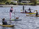 Kayakers gather on Sept. 18, 2020 at Lachine’s waterfront to show support for the city's plan to turn the marina there into a nautical park open to all Montrealers.