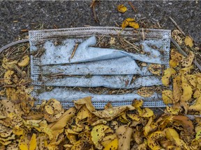 A discarded surgical mask lies in a pile of leaves in Montreal Monday September 28, 2020. Even once the pandemic is over, there is expected to be a longer-term impact on the demand for mental-health services.