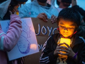 Five-year-old Luca Dubé attends a vigil on Sept. 29 for his mother, Joyce Echaquan, who died at a hospital in Joliette after she posted a video showing mistreatment by staff.