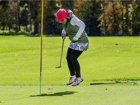 Nicole Tremblay celebrates sinking her putt on the ninth hole at Club de Golf Triangle d'Or in St-Remi, south of Montreal, on Oct. 1, 2020.