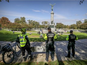 Montreal police were out in force at the foot of Mount Royal overlooking Parc Ave. on Sunday, Oct. 4, 2020.