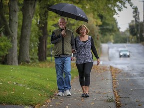 Bryan Doyle and Lucie Mauro enjoy a walk together near their home in Pointe-Claire.