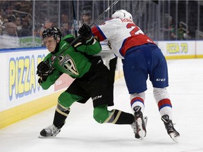 Prince Albert Raiders defenceman and Canadiens first-round draft pick Kaiden Guhle rolls off a check by Matthew Robertson of the Edmonton Oil Kings during WHL Eastern Conference Championship game in April 2019.