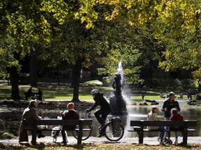 People enjoy a sunny but cold lunch hour in Outremont Park in Montreal, on Thursday, October 8, 2020. "Latin, us? Sorry, that’s balderdash. We live too far north to consider ourselves 'Latin.' We are northerners," Lise Ravary writes.