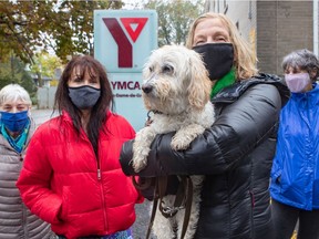 From left to right, Louise Marzinoto, Jeanne Masterson, Joan Simand (with her dog, Sadie) and Linda Solomon are worried the N.D.G. YMCA may not reopen and are trying to get answers from officials about the future.