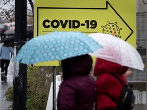 People leave the Jewish General Hospital's COVID-19 testing area in Montreal on Monday, Oct. 19, 2020.