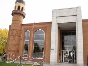 A man enters the Makkah-Al-Mukkaramah mosque in Pierrefonds Thursday. The mosque was one of three in the Montreal-area that have suffered break-ins in recent days.