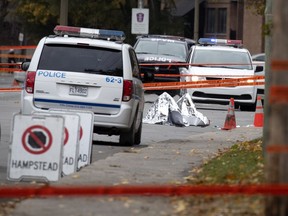 A discarded foil blanket marks the spot where a man was shot by police in Montreal on Thursday, Oct. 29, 2020.