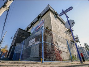 Security fencing surrounds the old Pioneer bar in Pointe-Claire Village in preparation for its demolition.