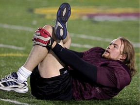 Concordia Stingers all-star defensive end Troy Cunningham stretches during practice in this October 2004 file photo.