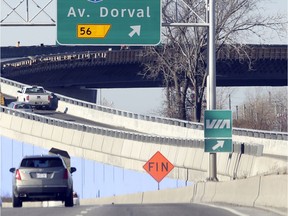 Workers put the finishing touches on the new ramp connecting Highway 20 West to Trudeau Airport, allowing drivers to avoid the Dorval Circle in November 2017.