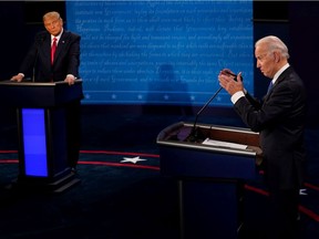 Democratic presidential candidate former Vice President Joe Biden answers a question as President Donald Trump listens during the second and final presidential debate at Belmont University on October 22, 2020 in Nashville, Tennessee. This is the last debate between the two candidates before the election on November 3.