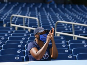 A lone fan of the Tennessee Titans cheers during the first half of a game against the Jacksonville Jaguars at Nissan Stadium on September 20, 2020 in Nashville, Tennessee.