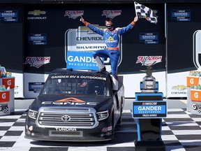 Raphael Lessard, driver of the #4 Canac Toyota, celebrates in Victory Lane after winning the NASCAR Gander RV & Outdoors Truck Series Chevy Silverado 250  at Talladega Superspeedway on Oct. 03, 2020.