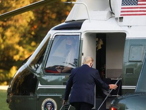 U.S. President Donald Trump boards Marine One on the South Lawn of the White House on Friday, Oct. 2, 2020, to fly to Walter Reed National Military Medical Center, where it was announced he will stay for at least several days after testing positive for the coronavirus disease.