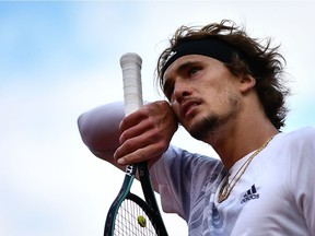 Germany's Alexander Zverev reacts as he plays against Italy's Jannik Sinner during their men's singles fourth round tennis match on Day 8 of The Roland Garros 2020 French Open tennis tournament in Paris on Sunday, Oct. 4, 2020.