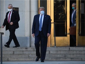 US President Donald Trump walks out of Walter Reed Medical Center in Bethesda, Maryland walking to Marine One on October 5, 2020, to return to the White House after being discharged. Trump had been hospitalized after contracting COVID-19.