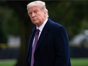 In this file photo taken on Oct. 1, 2020, U.S. President Donald Trump walks from Marine One after arriving on the South Lawn of the White House in Washington, D.C., following campaign events in New Jersey. Trump should be able to resume "public engagements" from Oct. 10, 2020, the White House physician announced on Oct. 8, saying the U.S. leader has responded "extremely well" to COVID-19 treatment.