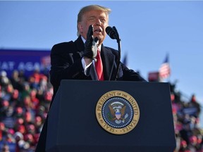 U.S. President Donald Trump speaks during a campaign rally at Green Bay Austin Straubel International Airport in Green Bay, Wisconsin on Oct. 30, 2020.