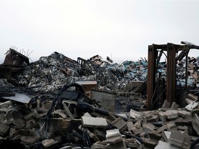 Fishes stacked onto of each other are visible after a lobster pound was destroyed by fire in Middle West Pubnico, Nova Scotia, on Oct. 17, 2020.