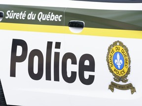 CP-Web. A Surete du Quebec police car is seen in Montreal on Wednesday, July 22, 2020. Quebec provincial police have made several arrests linked to an alleged romance scam that targeted elderly people online.
