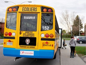 Many parents are concerned about their children's possible exposure to COVID-19 at school or on the school bus. Here, a child disembarks from a school bus in Saint-Jean-sur-Richelieu after schools reopened there in May.
