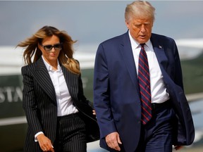 U.S. President Donald Trump and first lady Melania Trump board Air Force One as they depart Washington ahead of the first presidential debate on Sept. 29, 2020.