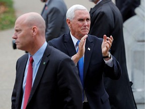 U.S. Vice President Mike Pence reacts to supporters outside the New Hampshire State House as he walks near his Chief of Staff Marc Short (L) after Pence filed candidacy papers for President Donald Trump to appear on the 2020 New Hampshire primary election ballot in Concord, New Hampshire, U.S., November 7, 2019.
