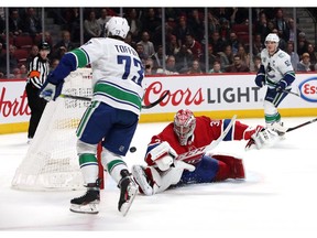Canucks right-winger Tyler Toffoli scores on Canadiens' Carey Price in overtime at the Bell Centre on Feb. 25, 2020.