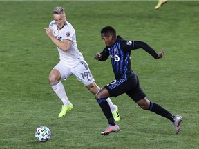 Montreal Impact forward Romell Quioto, right, controls the ball as New England Revolution defender Antonio Delamea Mlinar defends during the second half at Red Bull Arena on Oct. 14, 2020, in Harrison, N.J.